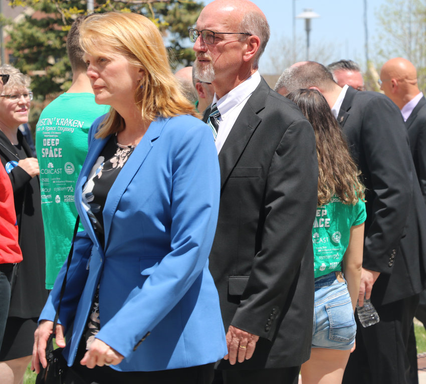 DCSD School Board President David Ray and board member Krista Holtzmann walk into a celebration for life for Kendrick Castillo on May 15 at Cherry Hills Community Church. Castillo was killed in a May 7 school shooting at STEM School Highlands Ranch.